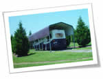 Carport.com photo of a motorcoach and RV cover