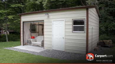 This view shows firewood and electrical work on the side of this metal garage workshop.