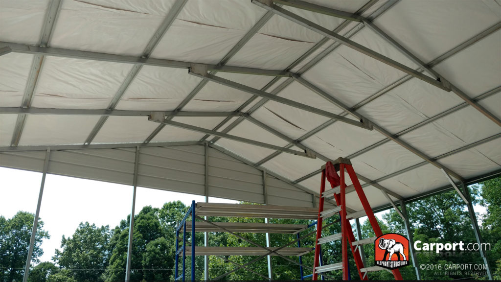 Ceiling of the structure is visible with bracing and framing.