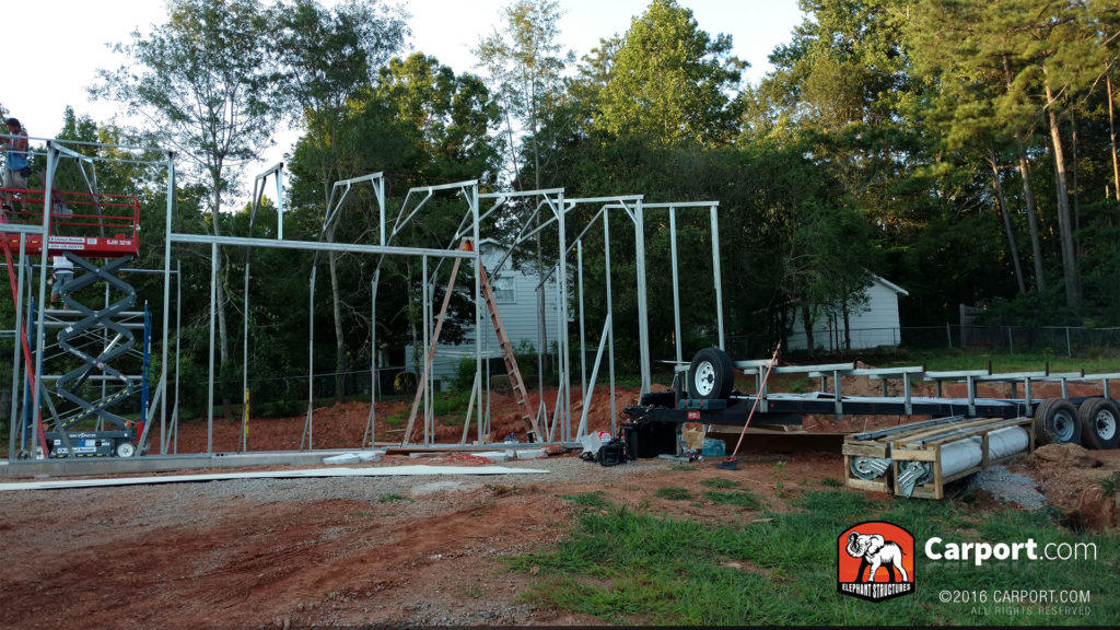 Scaffolding is used to apply the truss system to framing already completed.