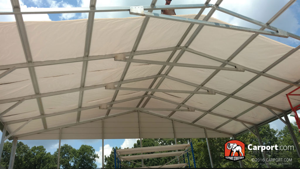 Ceiling framing and bracing with a worker on top.