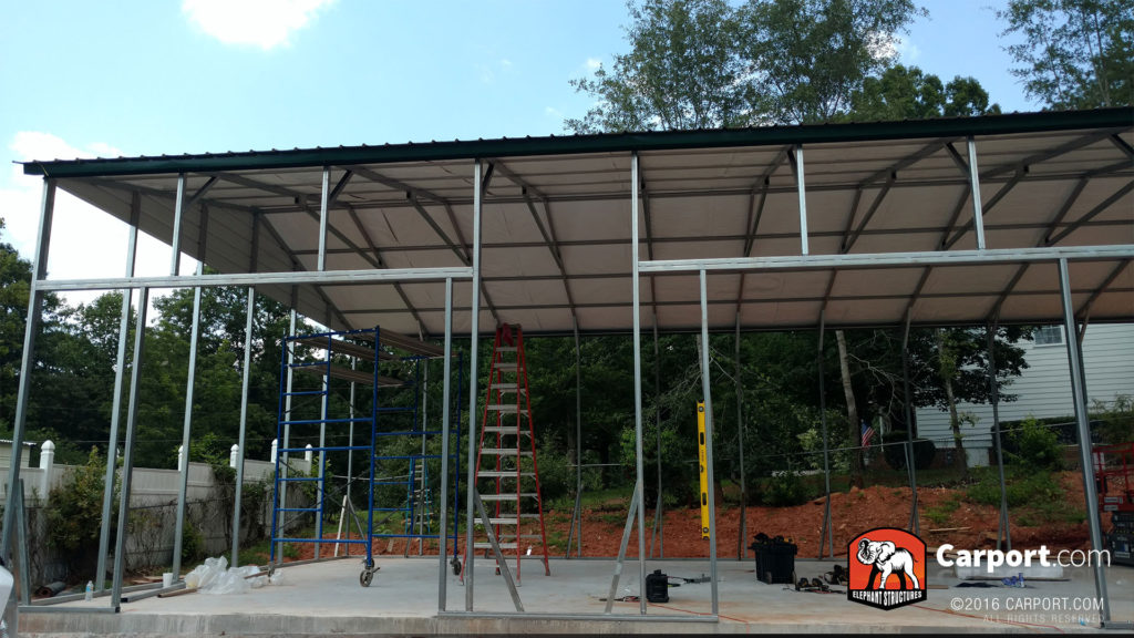Two roll up garage door frames and the ceiling panels.