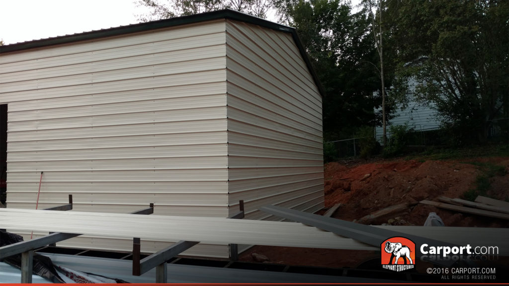 View of the garage with some of the load still on the trailer.