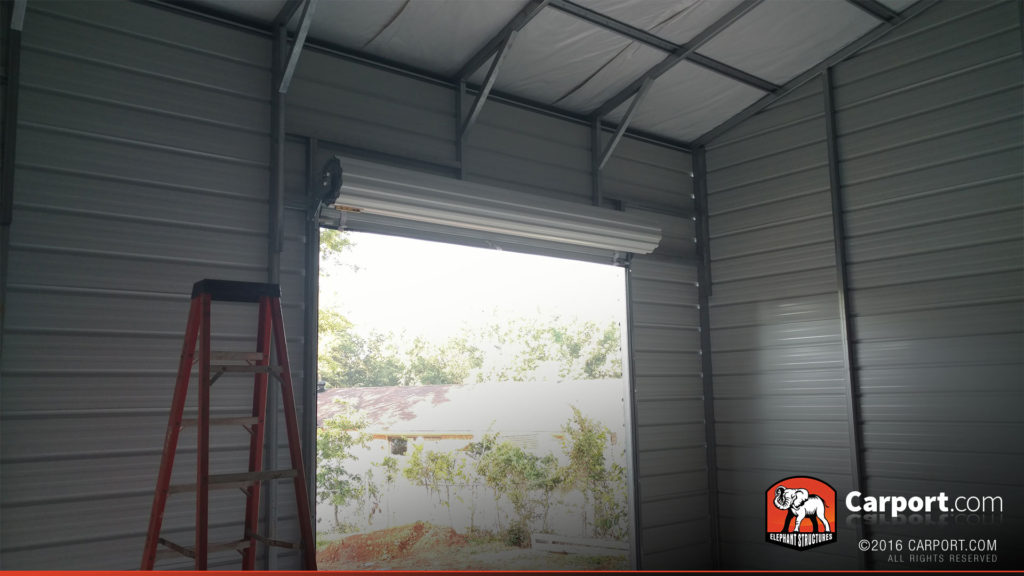 Interior of the garage with view of the roll-up garage door.