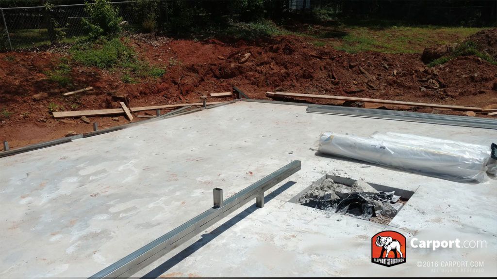 Concrete foundation and the beginning of the frame.