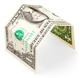 dollar bill folded into the shape of a carport.