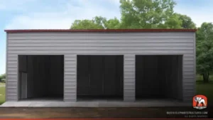 Three-bay gray metal garage with red trim and three roll-up doors