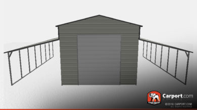 grey metal barn with two lean-tos on the side.